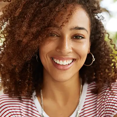  A young woman smiling.